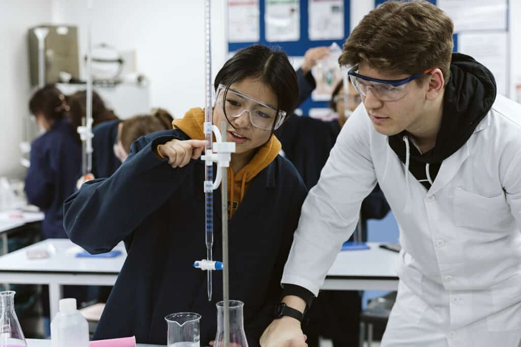 Two students doing a Science experiment